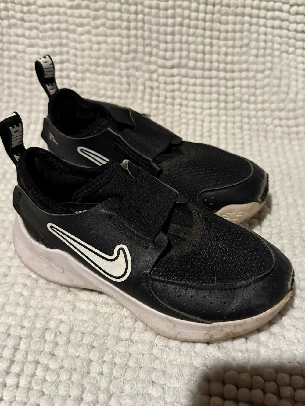 Nike Kids Black Slip-On Sneakers with White Swoosh